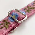 Pink fabric dog/cat or pet leash strap with floral embroidery and metal buckle on a white background