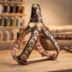 Decorative dog harness with floral pattern on a wooden surface