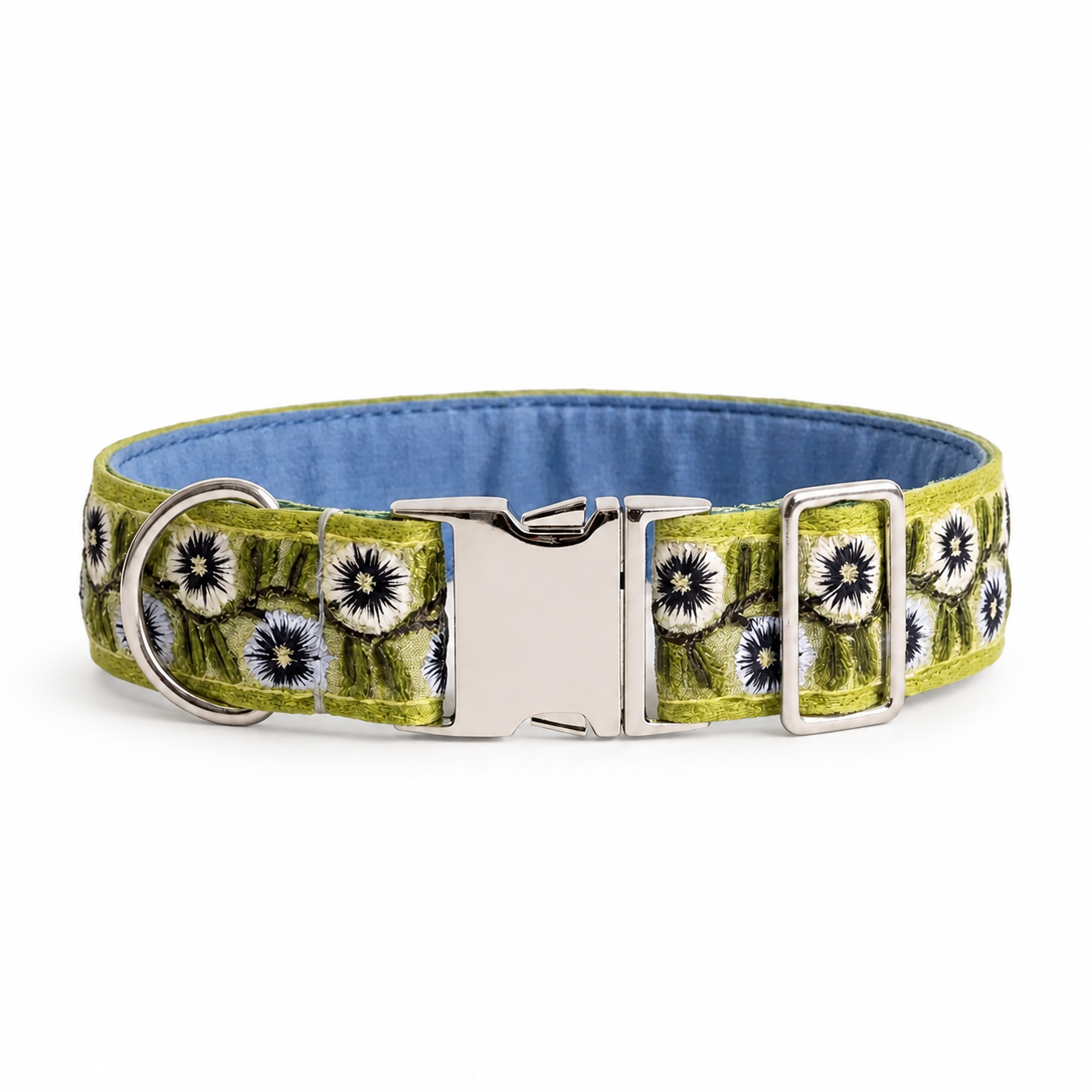 A dog collar with a lime green and black floral pattern, a blue fabric lining, and a silver-tone metal buckle and D-ring, shown on a plain white background.