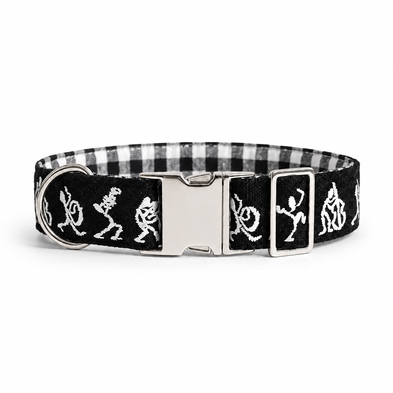 A black and white gingham dog collar with embroidered white occult symbols and a silver metal buckle.