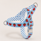 A blue and white gingham pet harness with blue polka dots and a strawberry and watermelon print, featuring silver metal hardware.
