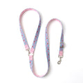 A light blue dog leash with a pink and white gingham border, a pink and red strawberry pattern, and silver metal hardware, displayed on a clean white background.