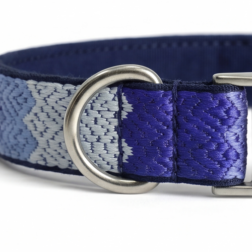 Blue and gray patterned dog collar with a silver D-ring on a white background