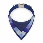 Blue dog collar with a patterned bandana on a white background