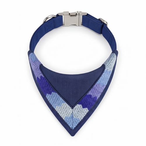 Blue dog collar with a patterned bandana on a white background