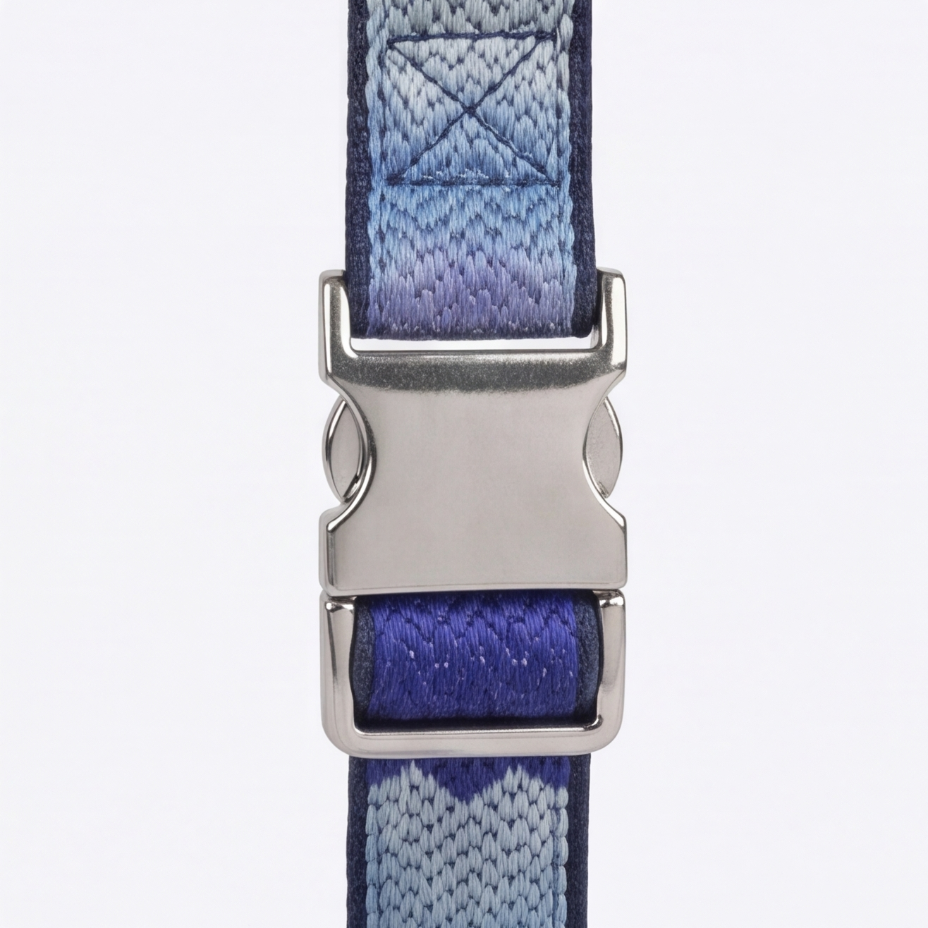 Blue and gray striped dog collar with a silver buckle on a white background