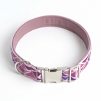 A pink and purple patterned dog collar with a silver metal buckle, photographed on a white background.